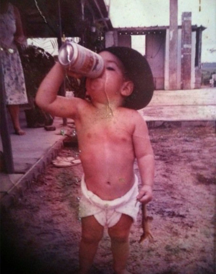16. “Me back in 1991 just your typical Aussie kid drinking XXXXlight beer and holding a baby crocodile!”