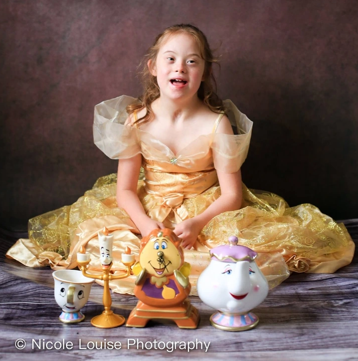 9. Holly Allan, at the age of 10, embodies the beauty and intelligence of Belle from Beauty and the Beast, bringing the iconic character to life with grace and charm.