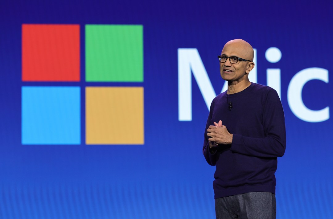 Microsoft shares hit a record high despite layoffs, as investors stayed confident while tech firms cut jobs and U.S. payrolls fell.