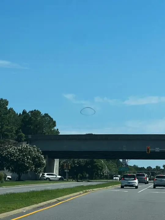 Fascinated locals did a great job documenting the smoke ring from different vantage points before it vanished.