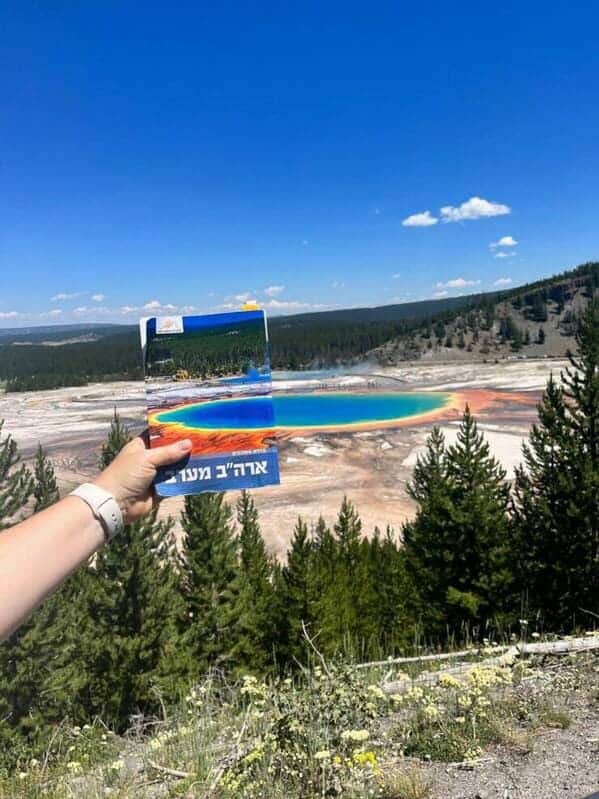 "Took a photo with our US West guidebook."