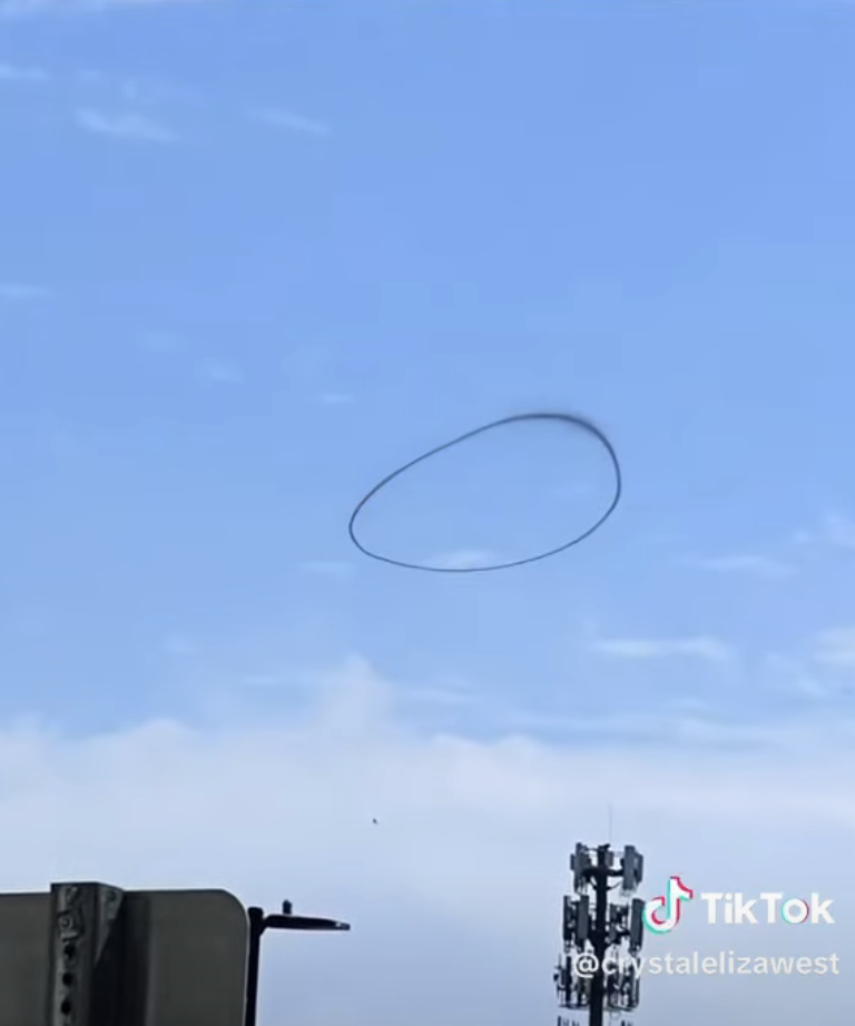 The black smoke ring looked drawn when it appeared on clear skies.